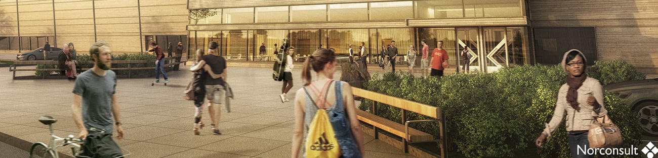 Människor i rörelse under solnedgång framför centrum för kultur och idrott.